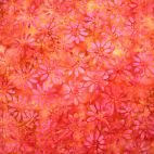 Tissu batik orange rouille fleurs fuchsia